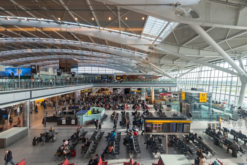 LONDON - MAY 21, 2015: People walking inside terminal of Heathro